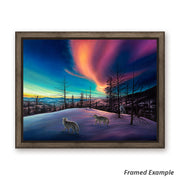 Framed 'Unreal Beauty' canvas art print, showcasing a pack of wolves against a stunning winter landscape