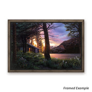 Framed 'Blissful Solitude' canvas art print displaying a rustic cabin amidst wildflowers with a breathtaking sunrise in Glacier National Park
