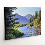 Bluebird Days canvas print - mountain peaks, river, moose and calf