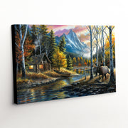 Western landscape canvas art print showcasing a majestic elk and quaint cabin against rugged mountain terrain