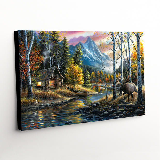 Western landscape canvas art print showcasing a majestic elk and quaint cabin against rugged mountain terrain