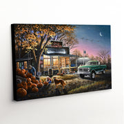 'The Harvest Moon' canvas print depicting the timeless charm of a country store scene, pumpkin patch, and a rustic truck amid fall hues